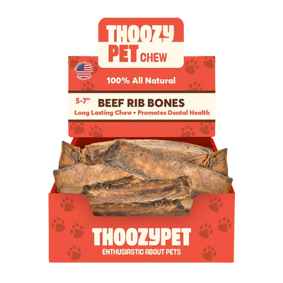 A red box labeled ThoozyPet contains 50 USA-sourced beef rib bone dog chews (5-7). Packaging highlights 100% all-natural treats, long-lasting chew, and dental health benefits.