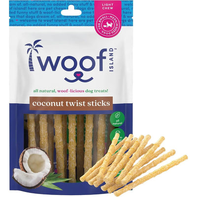 A bag of Woof Island Coconut Sticks - All Natural Rawhide Free Dog Chews for Healthy & Happy Pups is shown, with chews visible through a window and several twist sticks in front beside a halved coconut. From Woof Island.