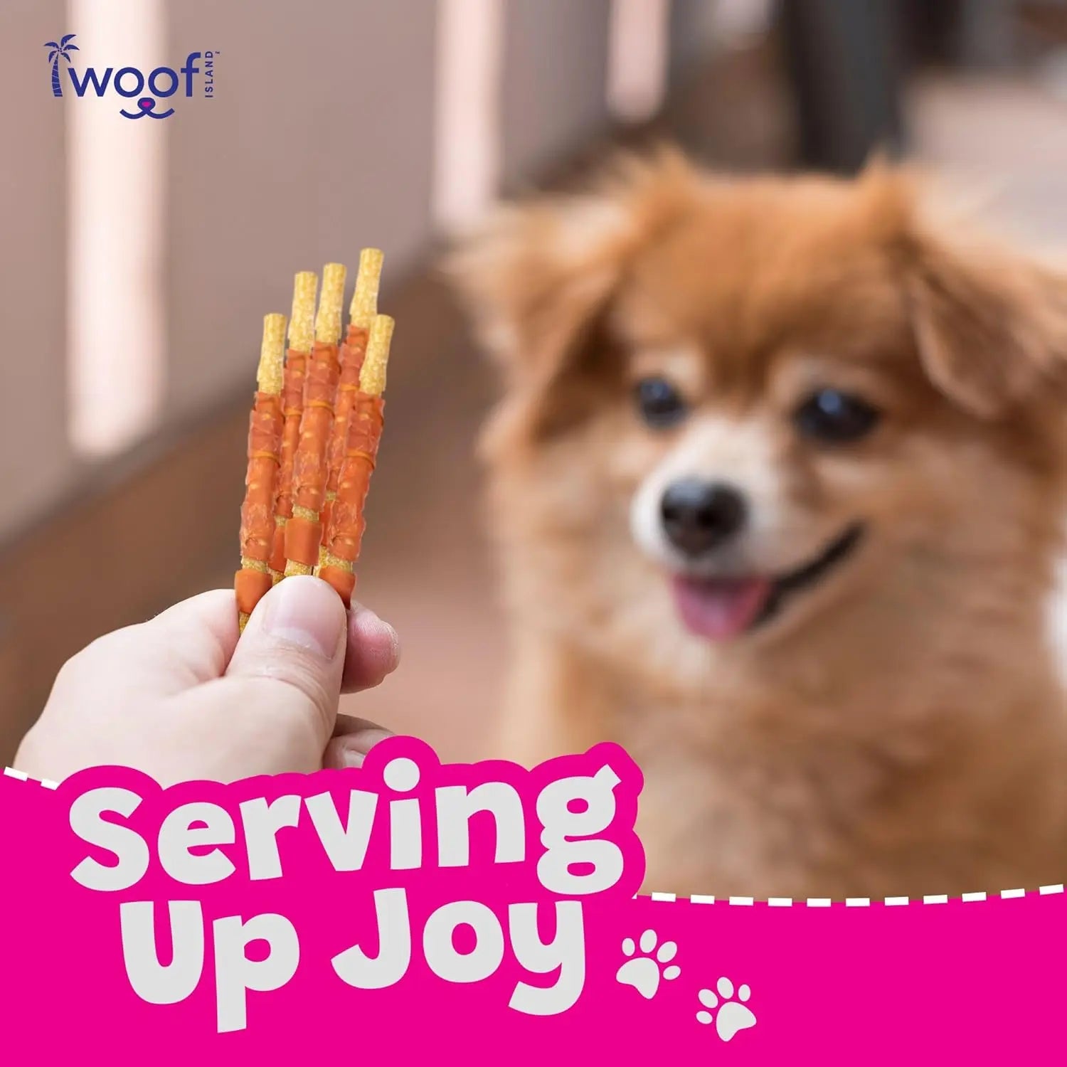 A hand offers Woof Island Healthy Rawhide Free Coconut and Chicken Chews to a small brown and white pup. The dog wags its tongue as bold “Serving Up Joy” text appears beside paw prints and the Woof Island logo—celebrating rawhide-free treats!.