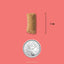 Acana Freeze-Dried Dog Food sample next to a Canadian quarter for size comparison