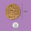 Acana freeze-dried dog food topper in a circular shape, measuring 2.5 inches in diameter