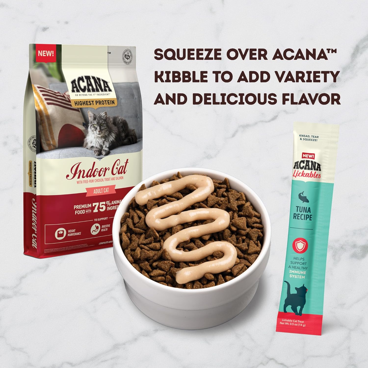 Acana immune support cat treats with tuna recipe squeezed over cat kibble for added flavor and variety