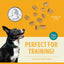 ACANA jerky bites poultry dog treats ideal for training, shown with a quarter for size reference
