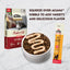 Talis Us healthy digestion cat treats drizzled over ACANA kibble for added flavor and nutrition