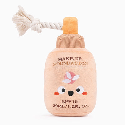 Hugsmart Pet makeup plush dog toy designed like a foundation bottle with rope for tugging fun