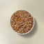 Now Fresh chicken and rice wet dog food in a bowl with peas and carrots for healthy dog meals