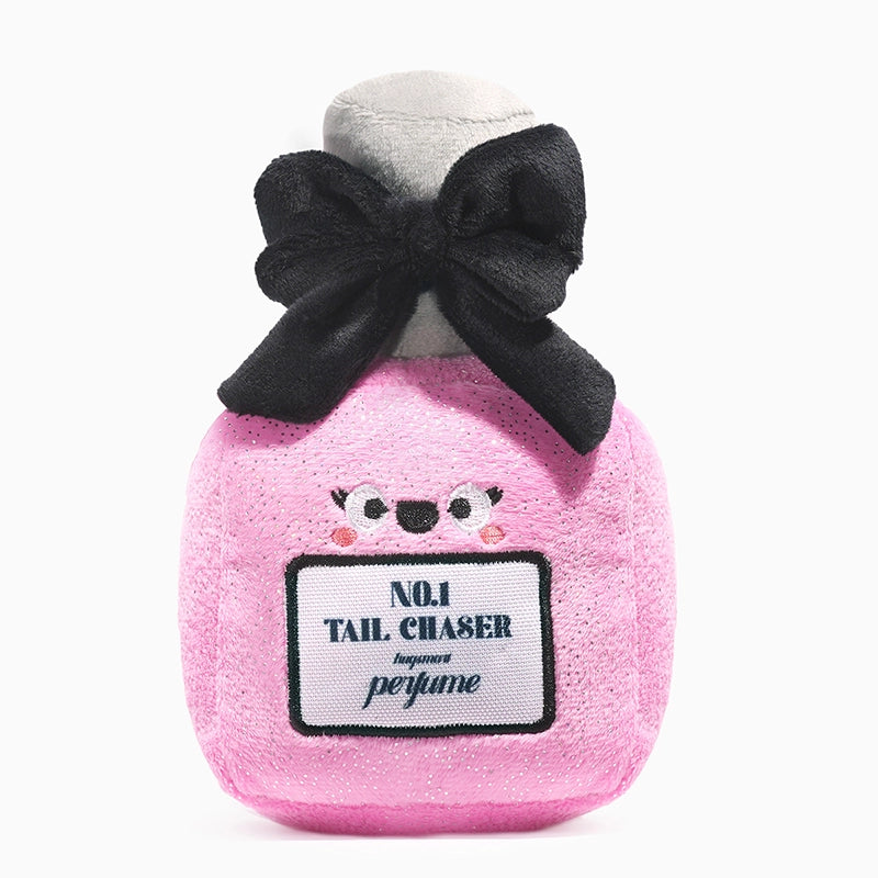 Hugsmart Pet plush perfume dog toy shaped like a pink perfume bottle with a bow