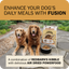 Two golden retrievers with a bowl of Redbarn Powerfood Fusion chicken dog food outdoors