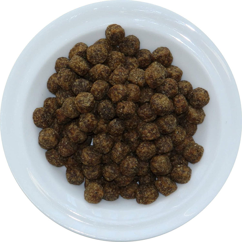 Walk About Pet vegan dog food in a white bowl, featuring nutritious crunch bites for dogs