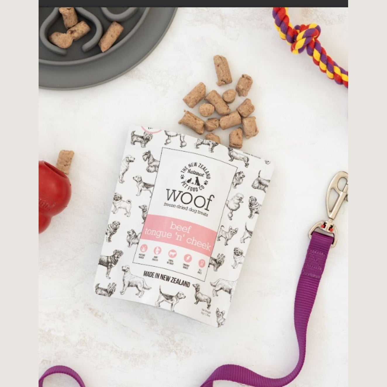 The New Zealand Natural Pet Food Co beef tongue dog treat in a stylish package with dog-shaped designs