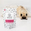 Woof Lamb Green Tripe Dog Food Topper from The New Zealand Natural Pet Food Co with a pug in the background