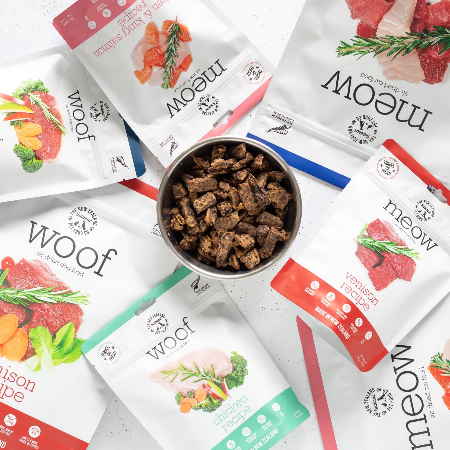 Variety of The New Zealand Natural Pet Food Co bags featuring venison air dried dog food and other flavors